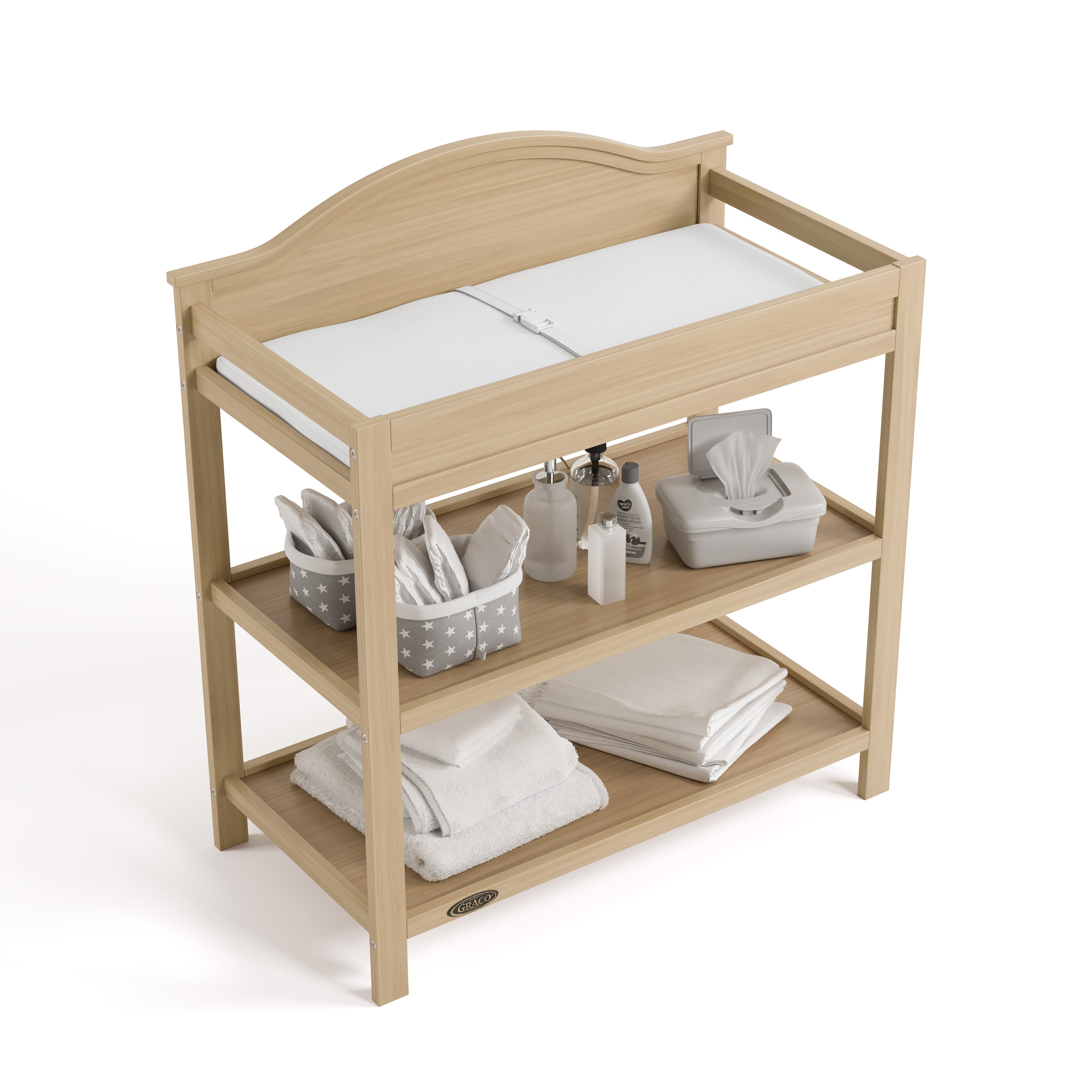 story driftwood changing table with changing pad and changing essentials top view