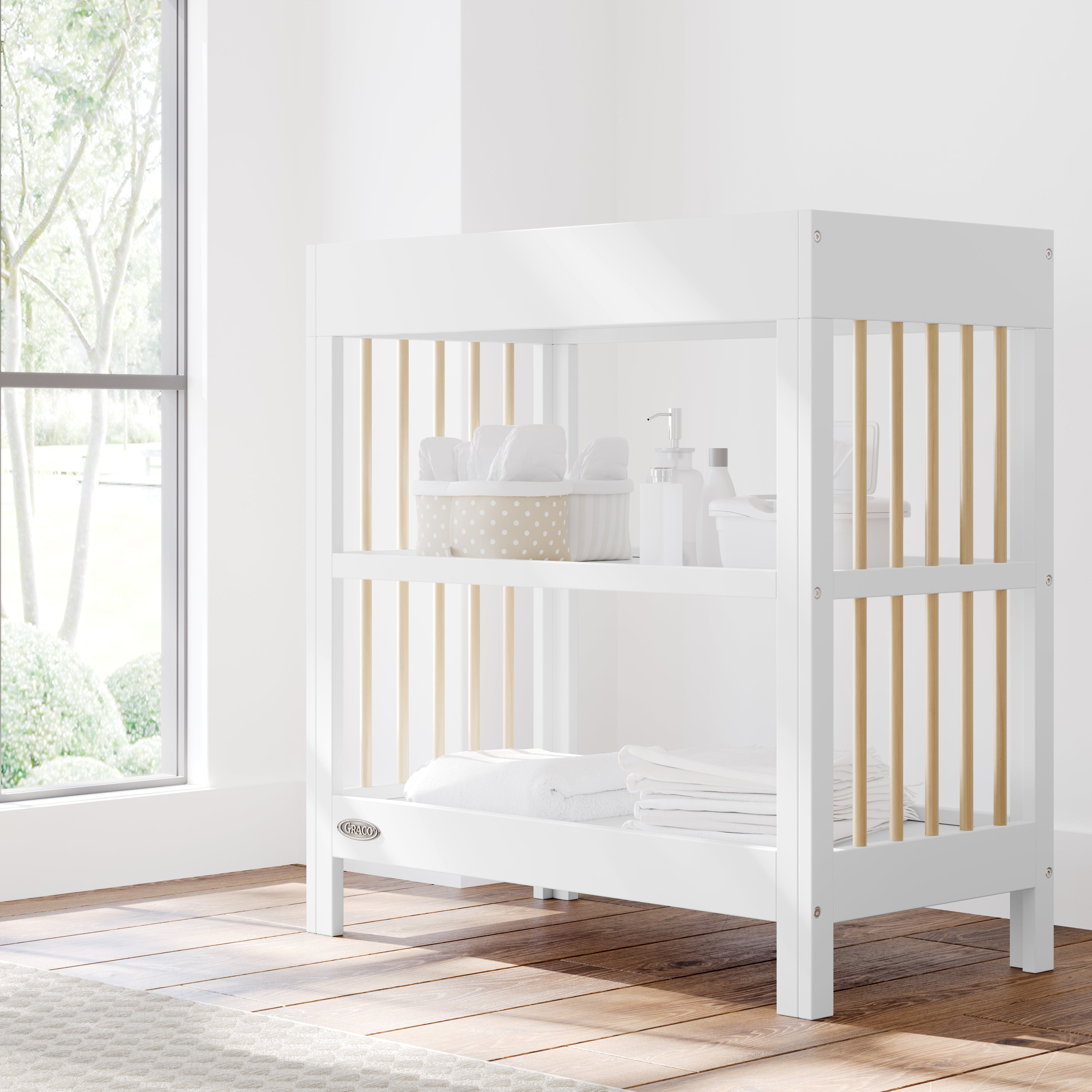 teddi white with driftwood changing table in nursery with changing essentials on both shelves