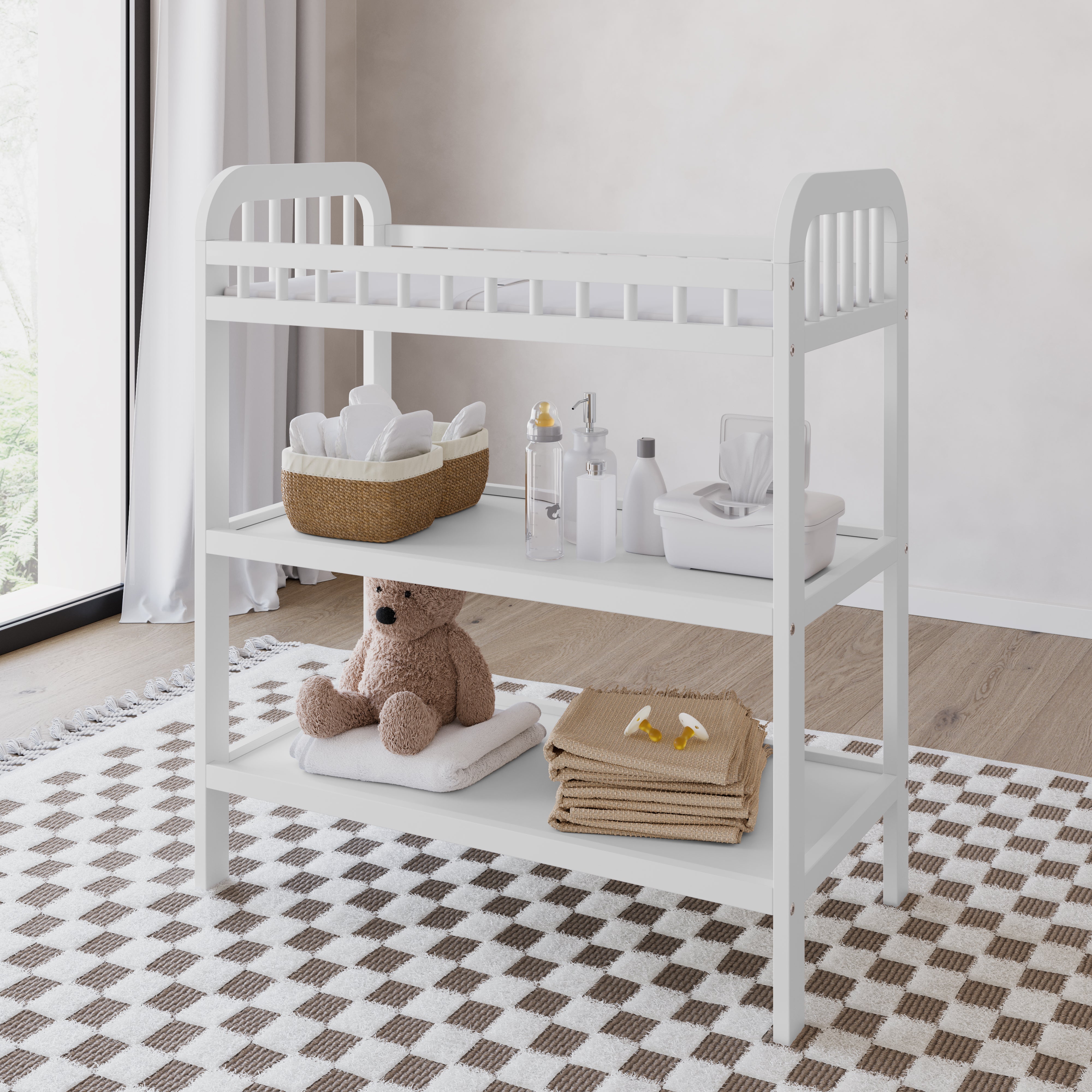 white pasadena changing table with items in bathroom 