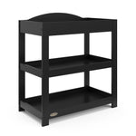 Black angled changing table with removable headboard and two open shelves