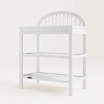 angled view of white changing table