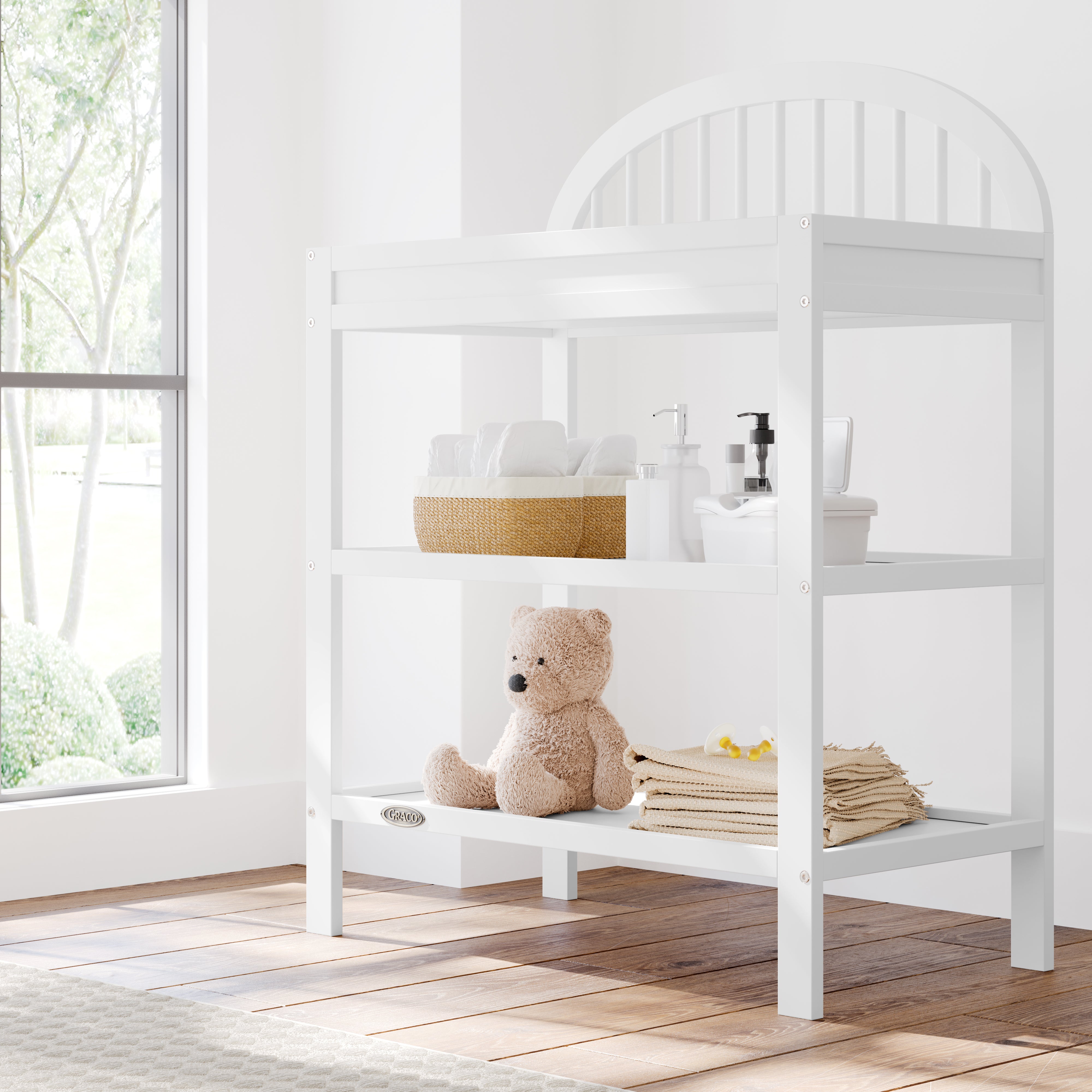 white changing table in nursery