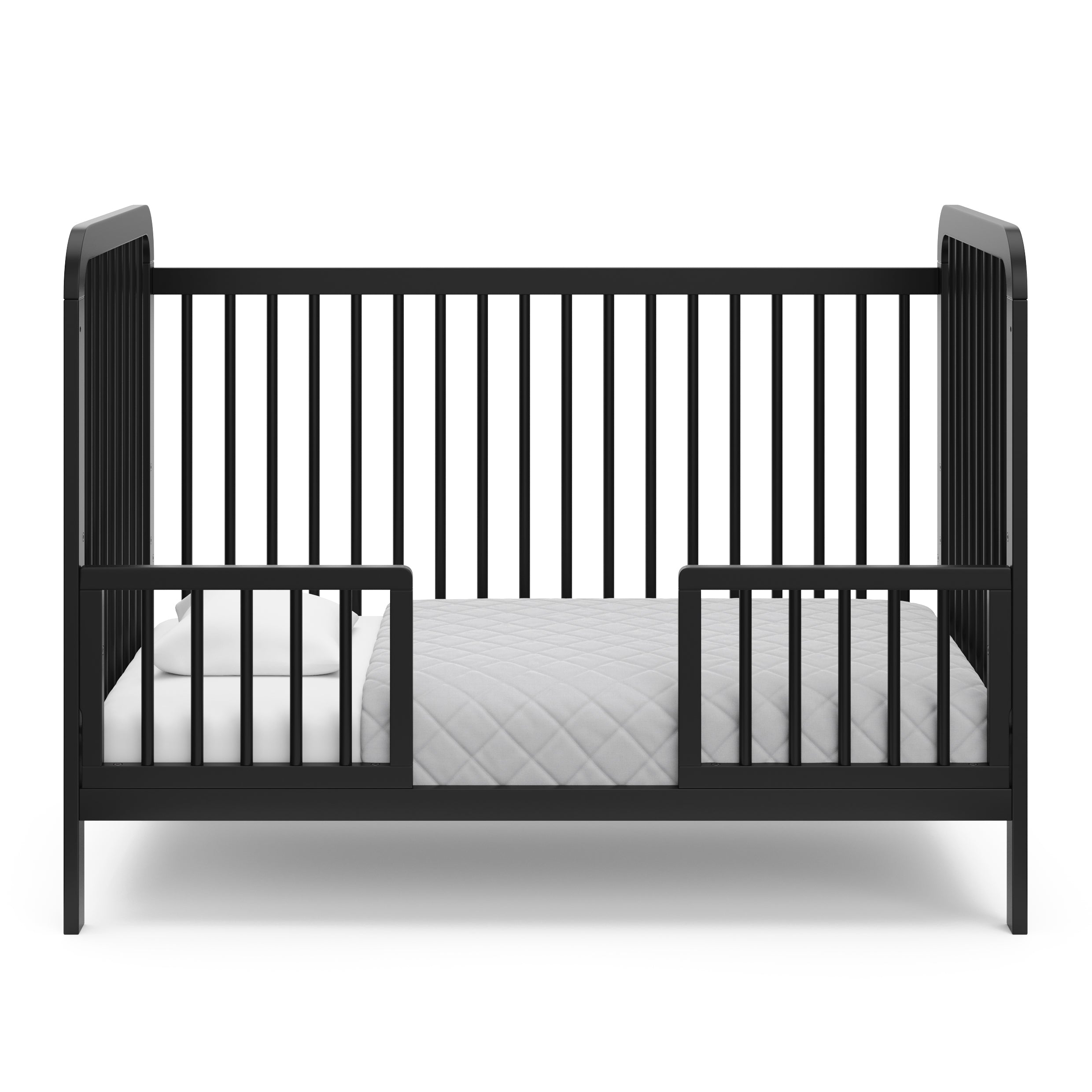 Black Toddler Safety Guardrail Kit with dowels applied in toddler bed