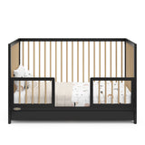 Black with driftwood Toddler Safety Guardrail Kit with dowels applied in toddler bed