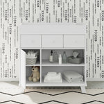 white changing table in nursery