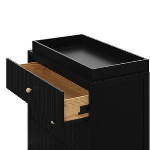 top view of 3 drawer chest with topper and one open drawer