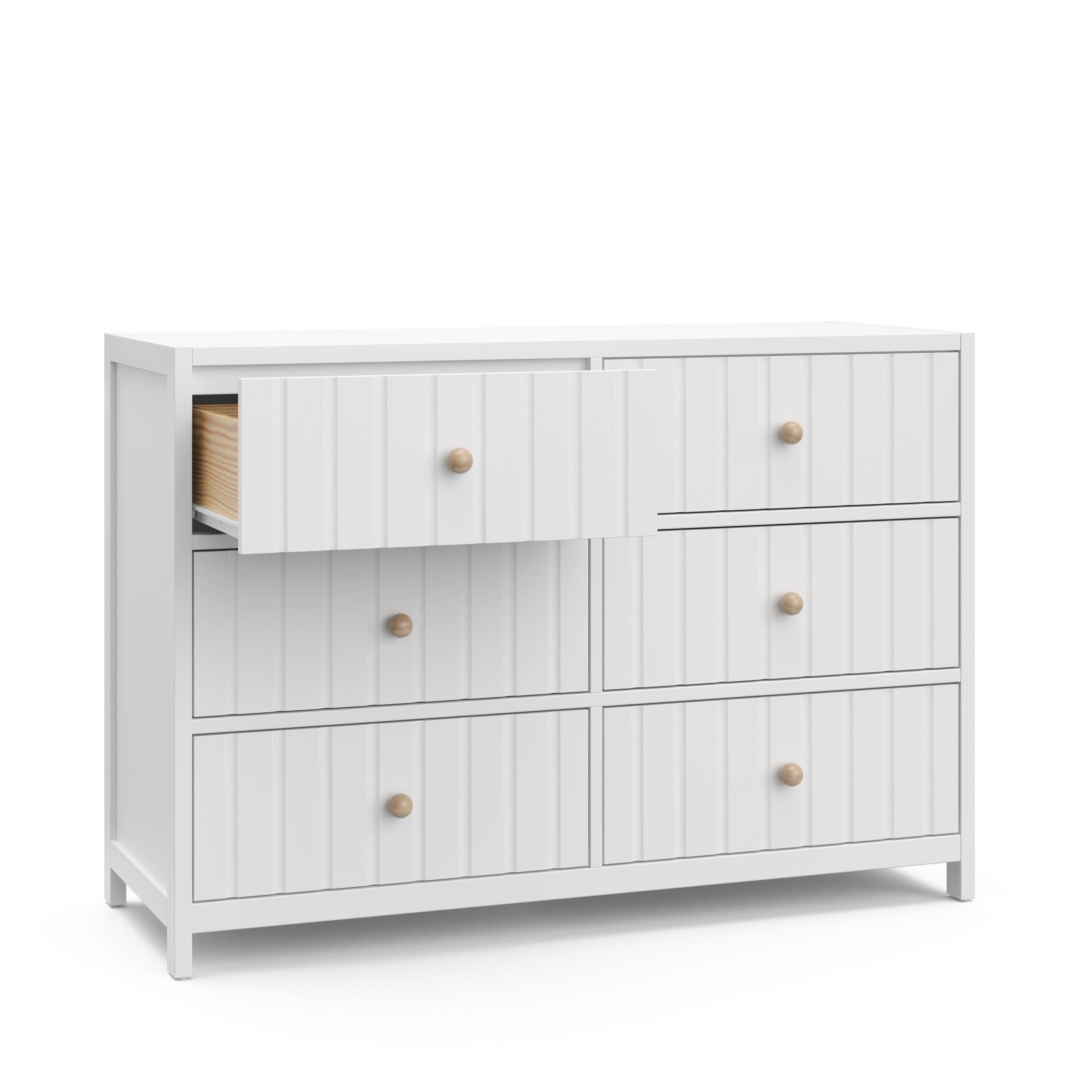 Angled view of white 6 drawer dresser with open drawer