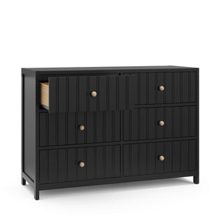 Angled view of black 6 drawer dresser with open drawer