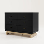 Angled view of black 6 drawer dresser with driftwood base