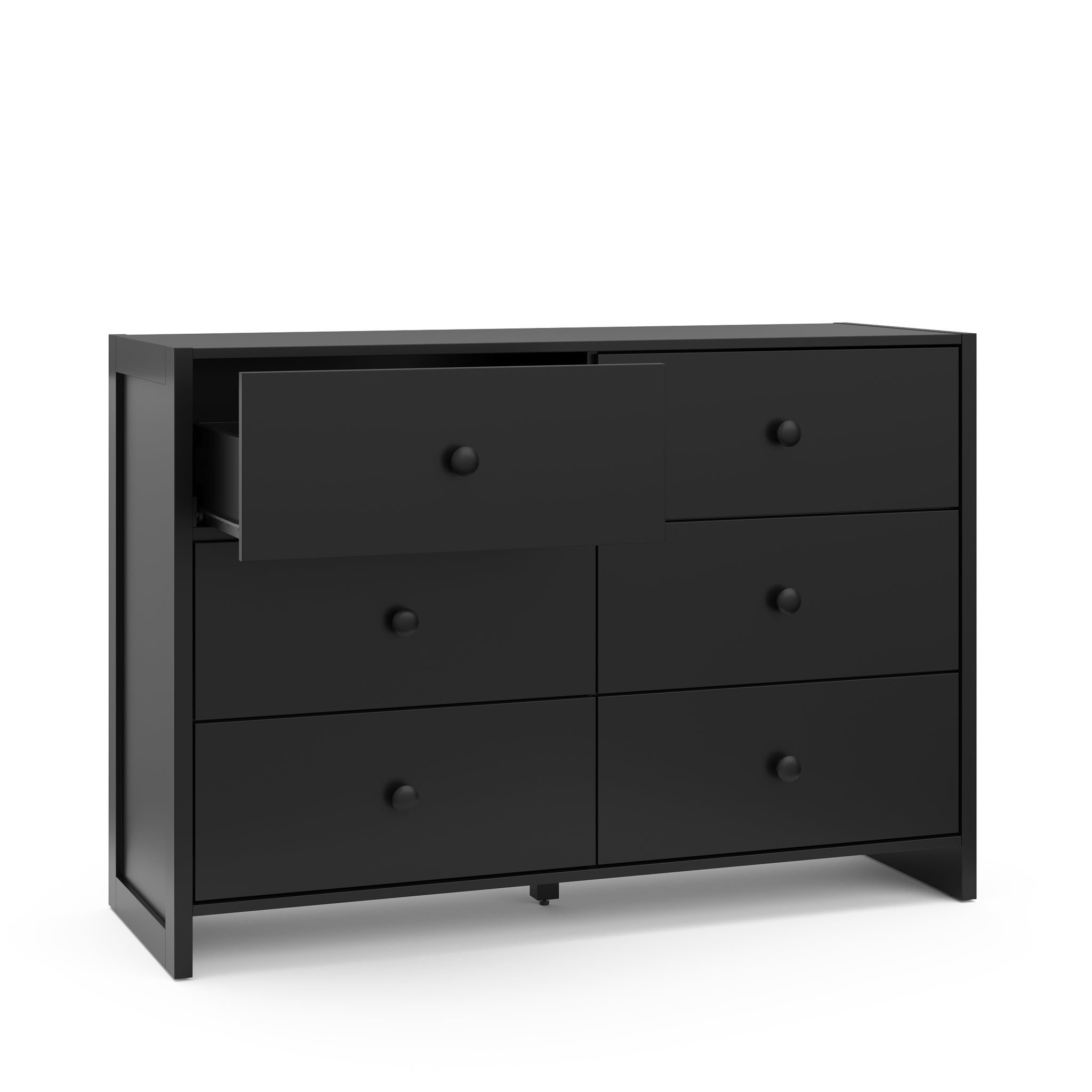 Angled view of black dresser with one open drawer
