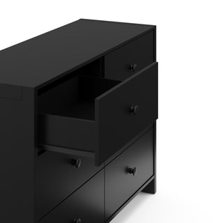 Top-angled view of a black dresser with one open drawer