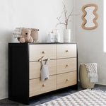 Black with driftwood dresser in a nursery