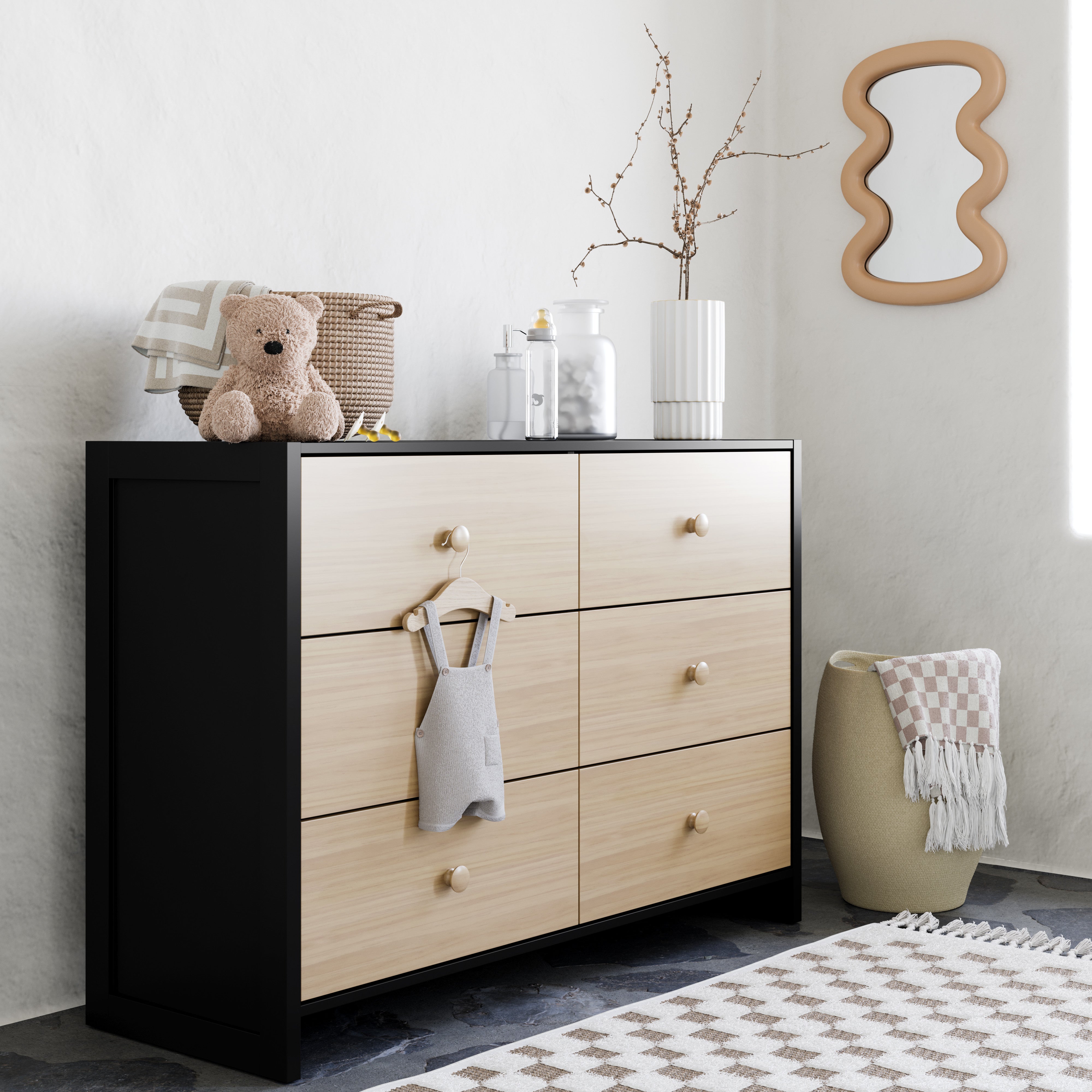 Black with driftwood dresser in a nursery