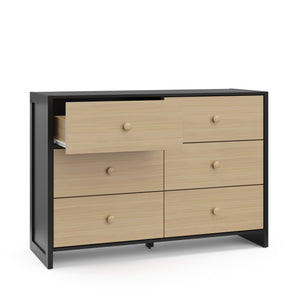Angled view of black with driftwood dresser with one open drawer