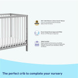 pebble gray and white mini crib with awards and certifications