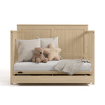 hadley driftwood crib with drawer daybed conversion with pillows blanket and teddy bear