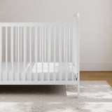 white crib in nursery