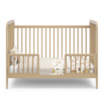 Driftwood crib in toddler bed conversion with two guardrails