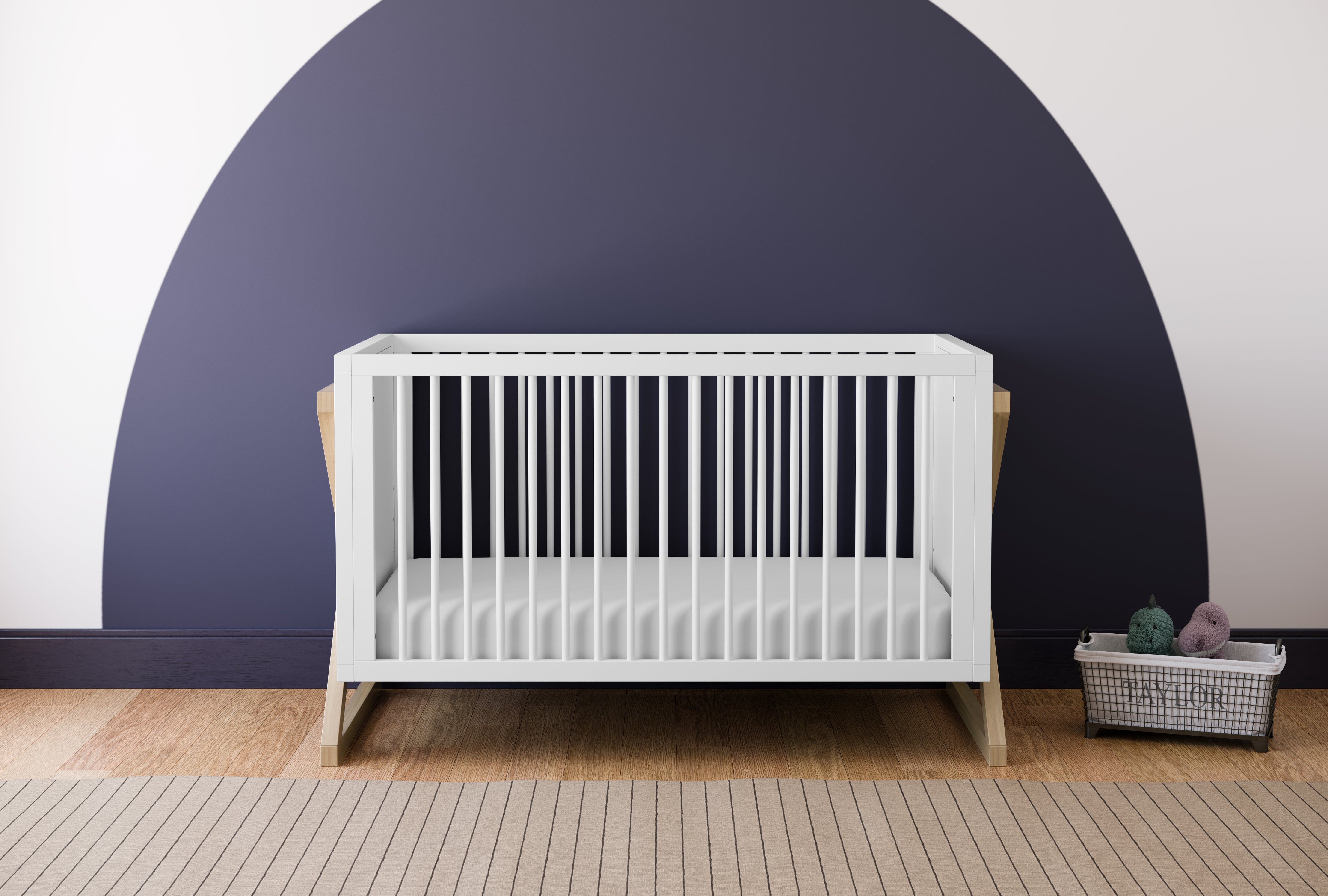 white and driftwood crib in nursery