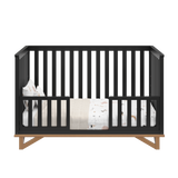 black with vintage driftwood crib in toddler bed conversion with two toddler safety guardrails