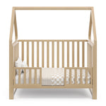 Crib with canopy in toddler bed conversion with guardrails (Drifftwood)