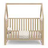 Crib with canopy in toddler bed conversion with guardrails (Drifftwood)