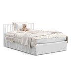 White crib in full-size bed with headboard conversion