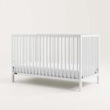 Angled view of white crib