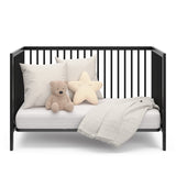 Black crib in daybed conversion with two guardrail