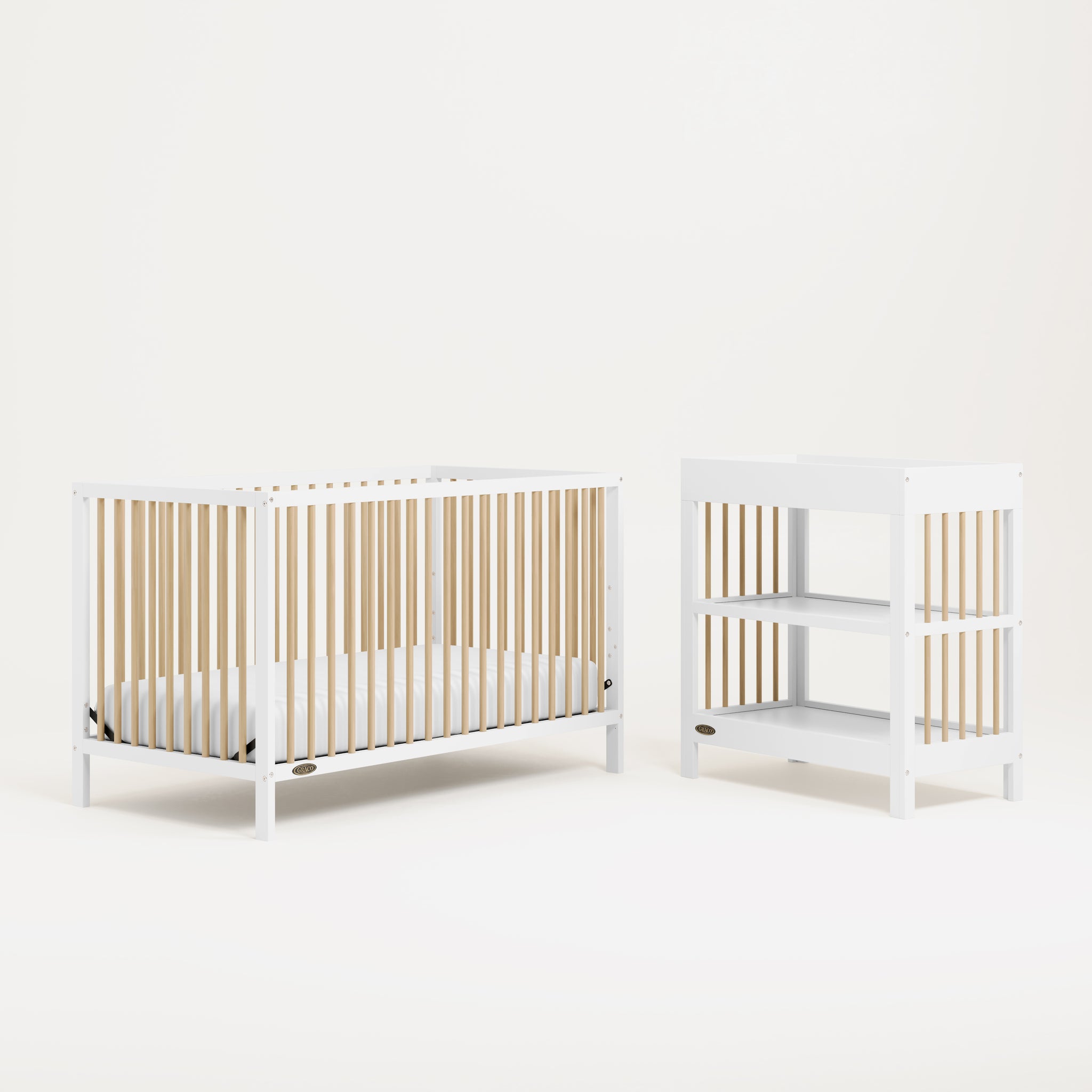 White crib and changing table with driftwood dowels