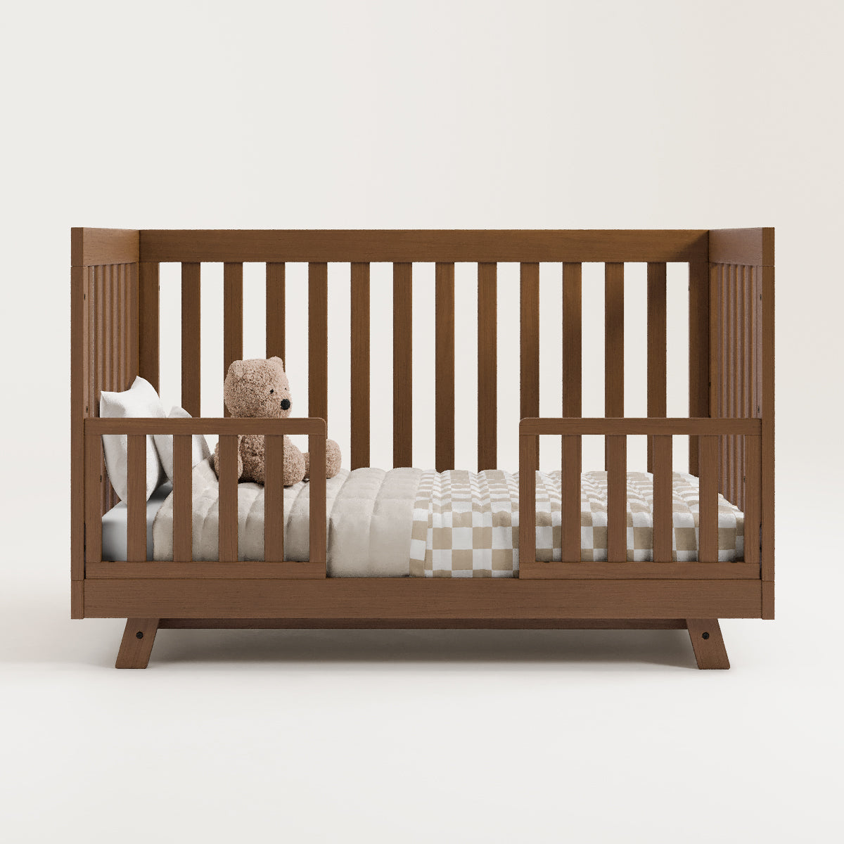 Crib in toddler bed conversion with guardrails (Hazelnut)