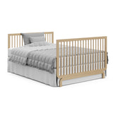 Storkcraft® Santorini® Deluxe 5-in-1 Convertible Crib with Bonus Toddler Guardrail.