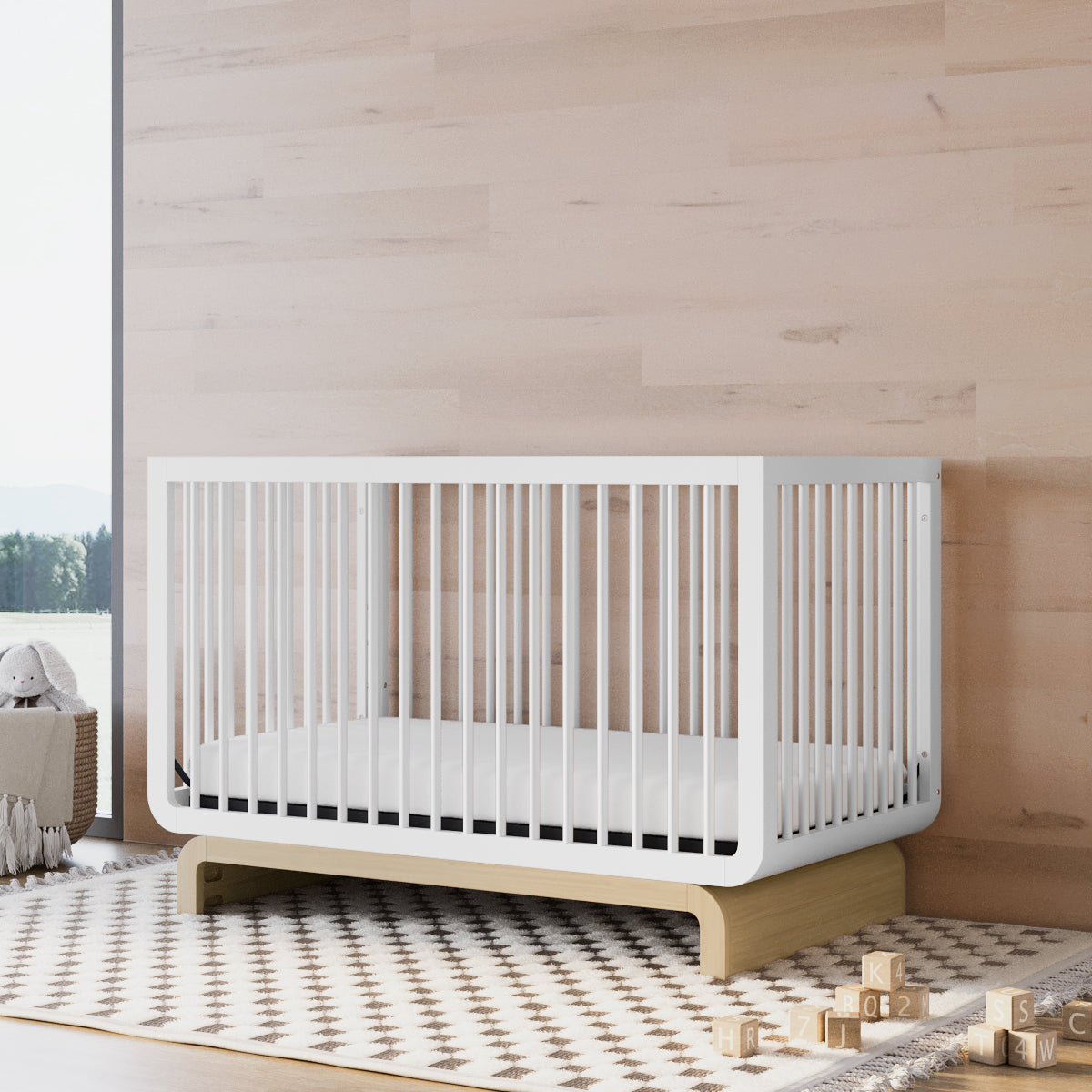 Convertible crib in white with driftwood colorway in a nursery (White with Driftwood)