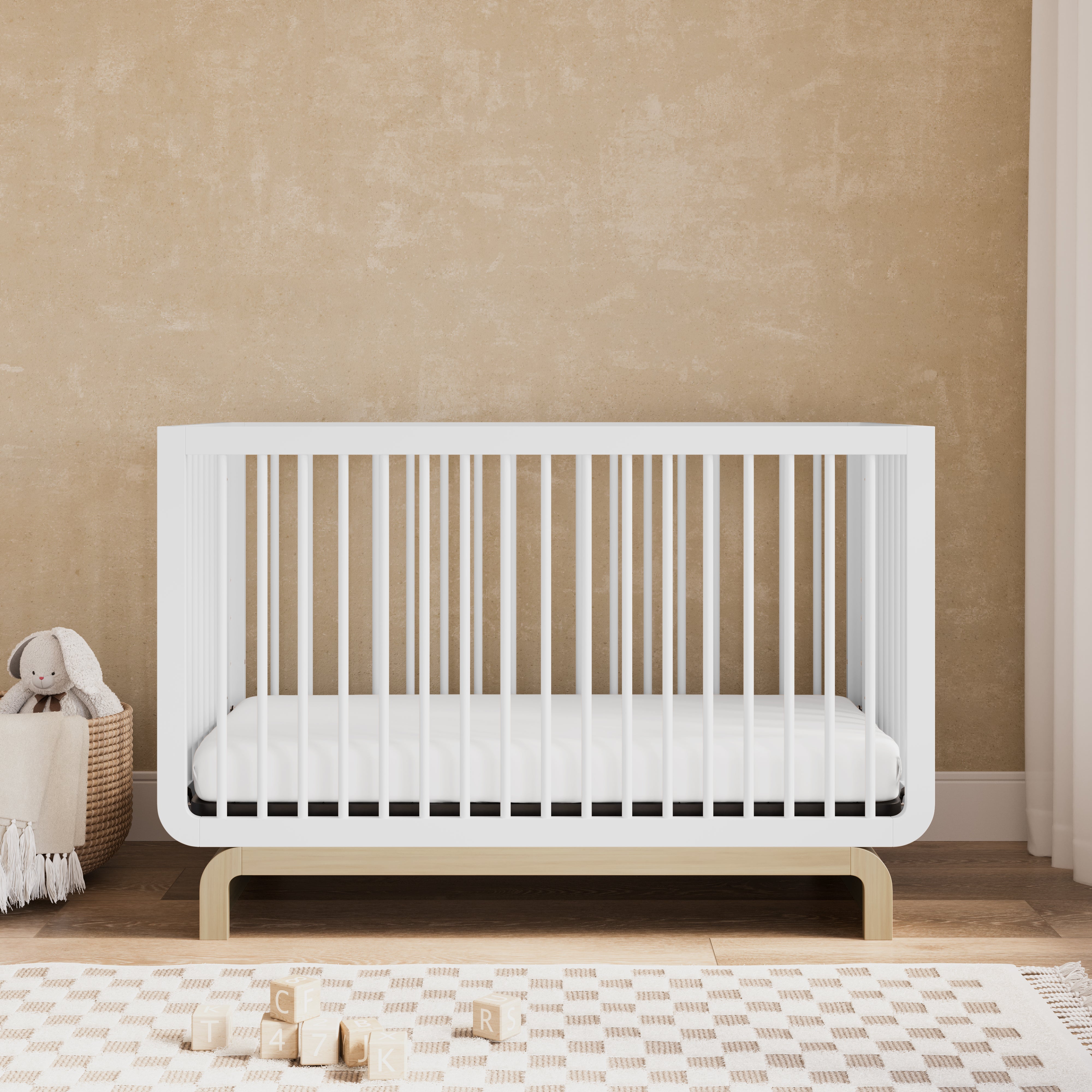 Convertible crib in white with driftwood colorway in a nursery (White with Driftwood)