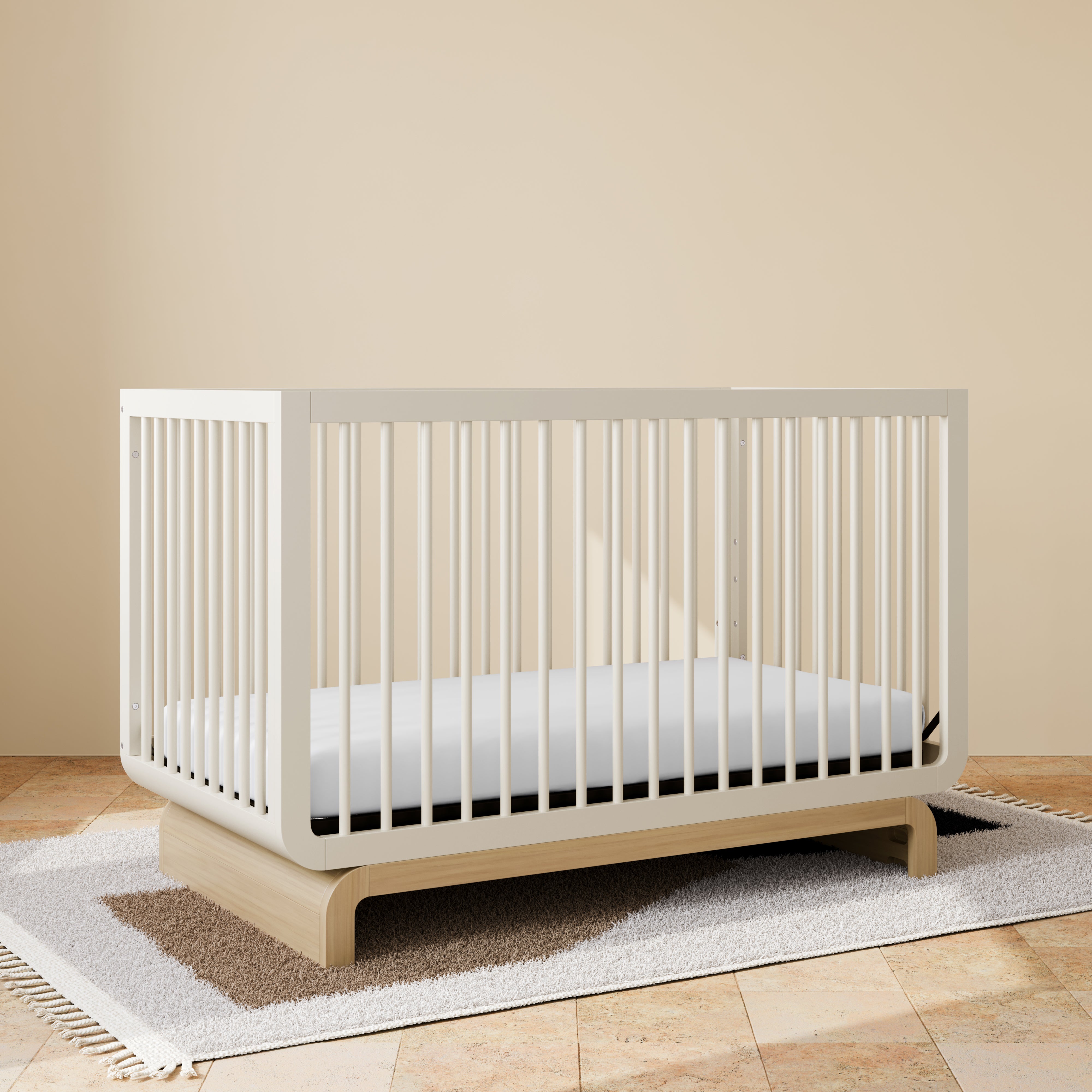 Convertible crib in frosted oat with driftwood colorway in a nursery (Frosted Oat with Driftwood)