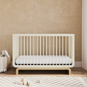 Convertible crib in frosted oat with driftwood colorway in a nursery (Frosted Oat with Driftwood)