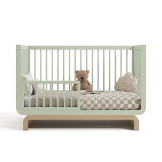 crib in a toddler bed conversion with one guardrail (Sage with Driftwood)