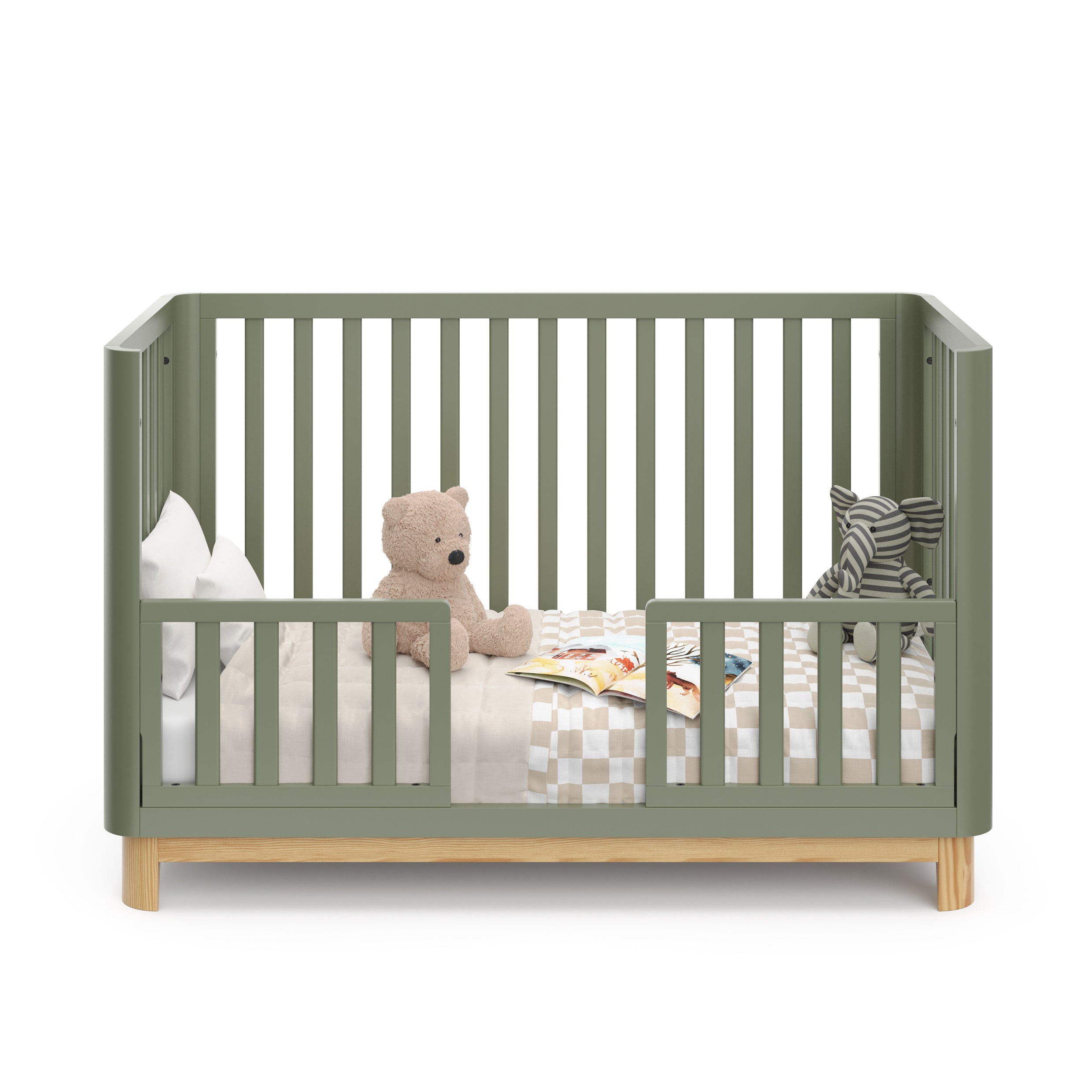 Front view of an olive crib with a natural wood color base, featuring guard rails in toddler bed conversion