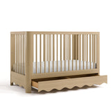 crib with drawer open driftwood angled view