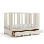 crib with drawer open frosted oat angled view