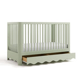 crib with drawer open sage angled view