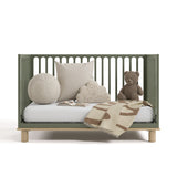 sicily olive with driftwood crib daybed conversion with blanket, pillows, and teddy bear