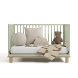 sicily sage with driftwood crib daybed conversion with blanket, pillows, and teddy bear