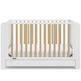 Graco® Read-with-Me™ 4-in-1 Convertible Bookshelf Crib with Drawer.