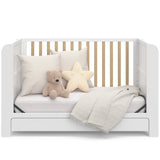 Graco® Read-with-Me™ 4-in-1 Convertible Bookshelf Crib with Drawer.