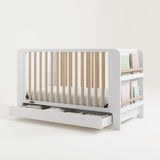 Graco® Read-with-Me™ 4-in-1 Convertible Bookshelf Crib with Drawer.