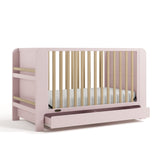 Read-with-Me crib blush with driftwood angle view with empty drawer open