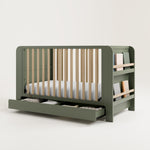 Graco® Read-with-Me™ 4-in-1 Convertible Bookshelf Crib with Drawer.