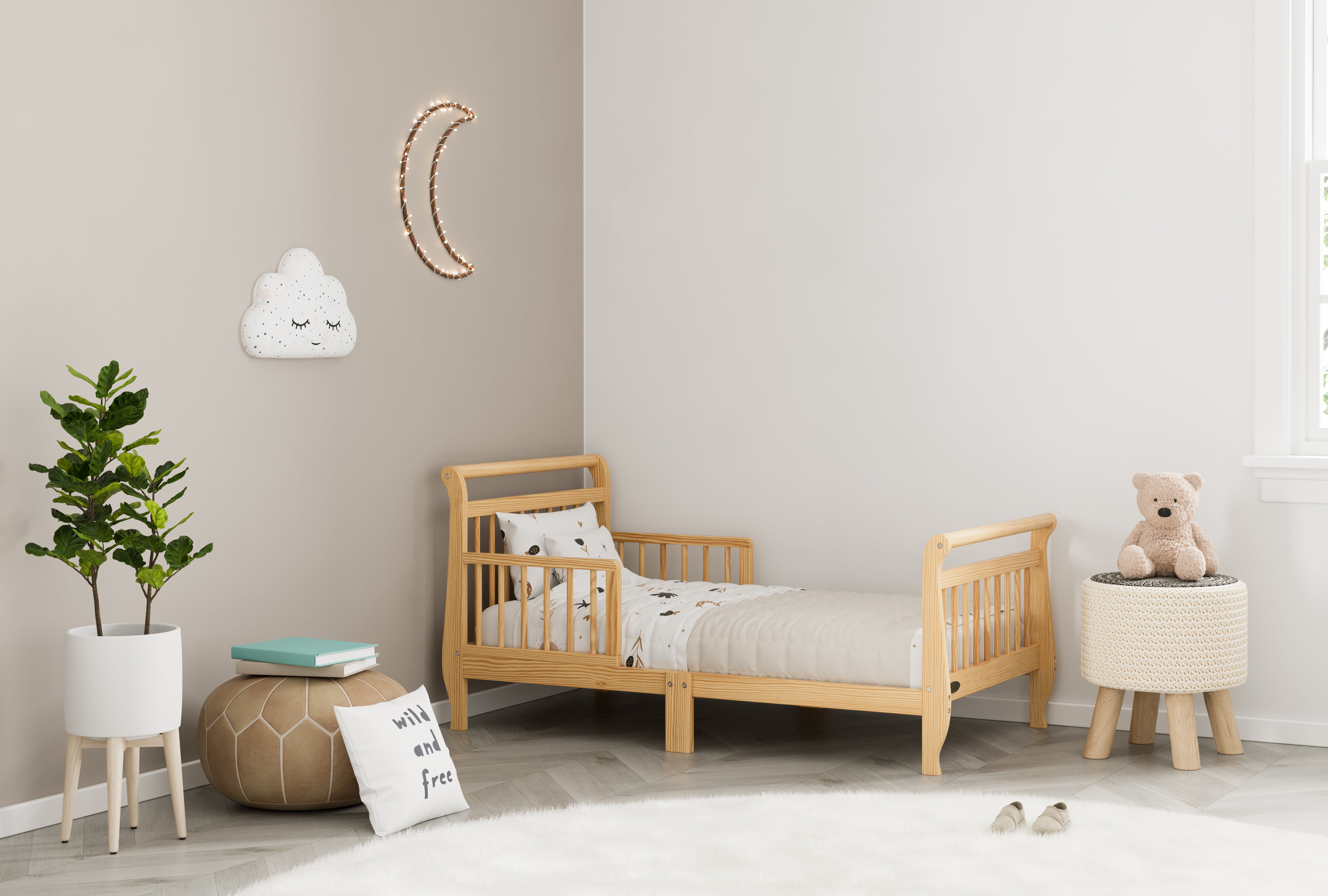 natural toddler bed with guardrails in nursery