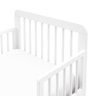 Detail view of a white toddler bed